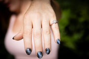 hand with cremation leaf ring being worn by woman